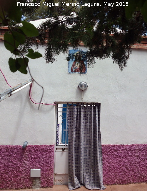Casería Villa Milagrosa - Casería Villa Milagrosa. Puerta trasera con el Sagrado Corazón
